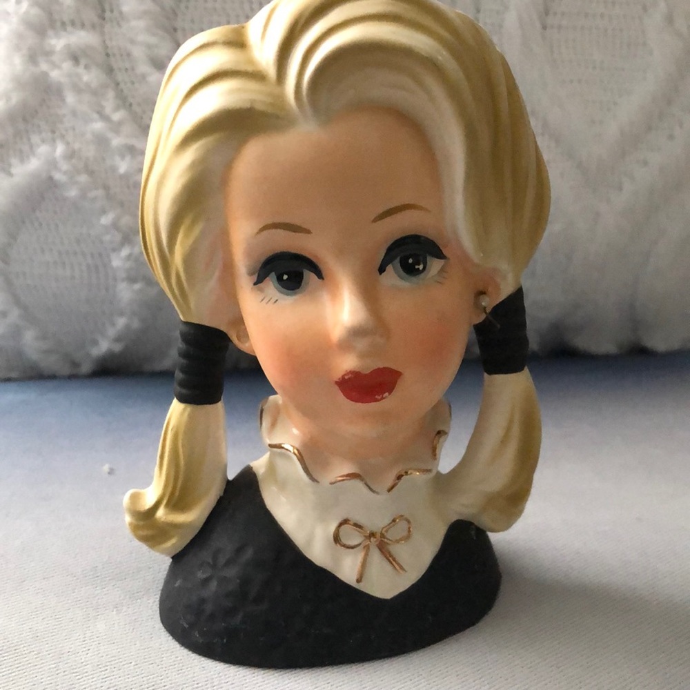 Vintage head vase blonde hair blue eyes, white ruffle collar shirt gold bow.